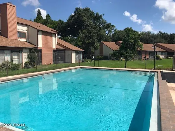 a view of a house with a swimming pool