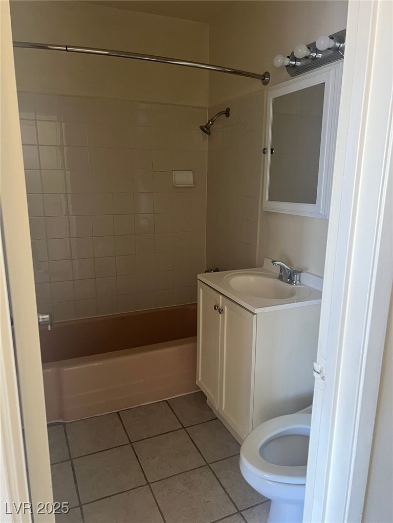 1388 East Desert Inn Road, Unit 1 Las Vegas, NV 89169 - Photo 16 of 17 Full bath with tile patterned flooring, shower / bath combination, vanity, and toilet