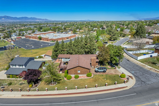 12080 Mill Ridge Circle Sandy, UT 84094 - Photo 49 of 56 Brick exterior residence with a brown shingle roof situated on a corner lot