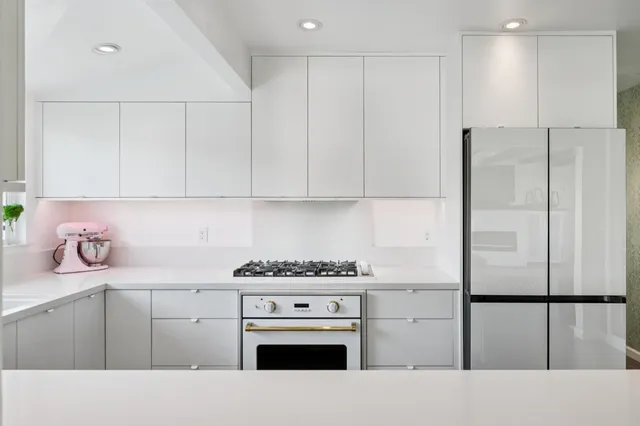 a kitchen with cabinets and appliances