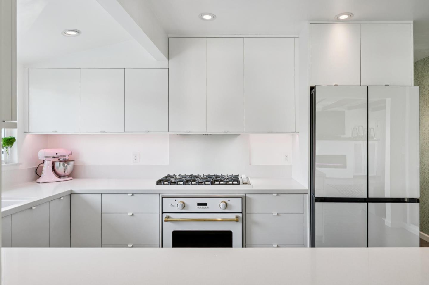 5 Bush Street Monterey, CA 93940 - Photo 13 of 48 a kitchen with cabinets and appliances