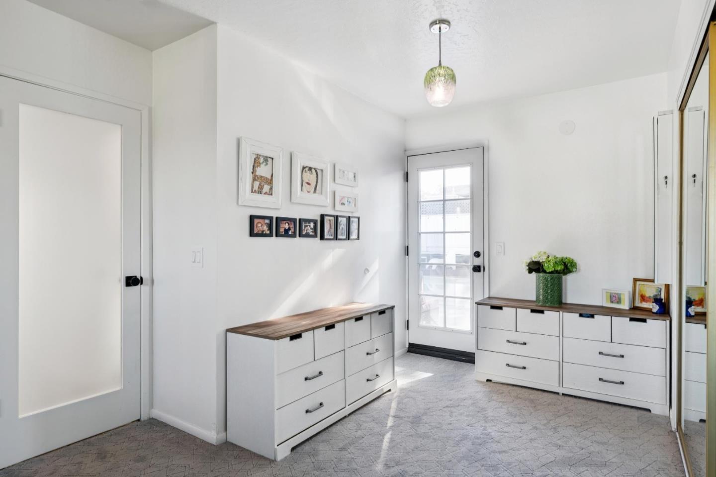 5 Bush Street Monterey, CA 93940 - Photo 23 of 48 a room with window and cabinet