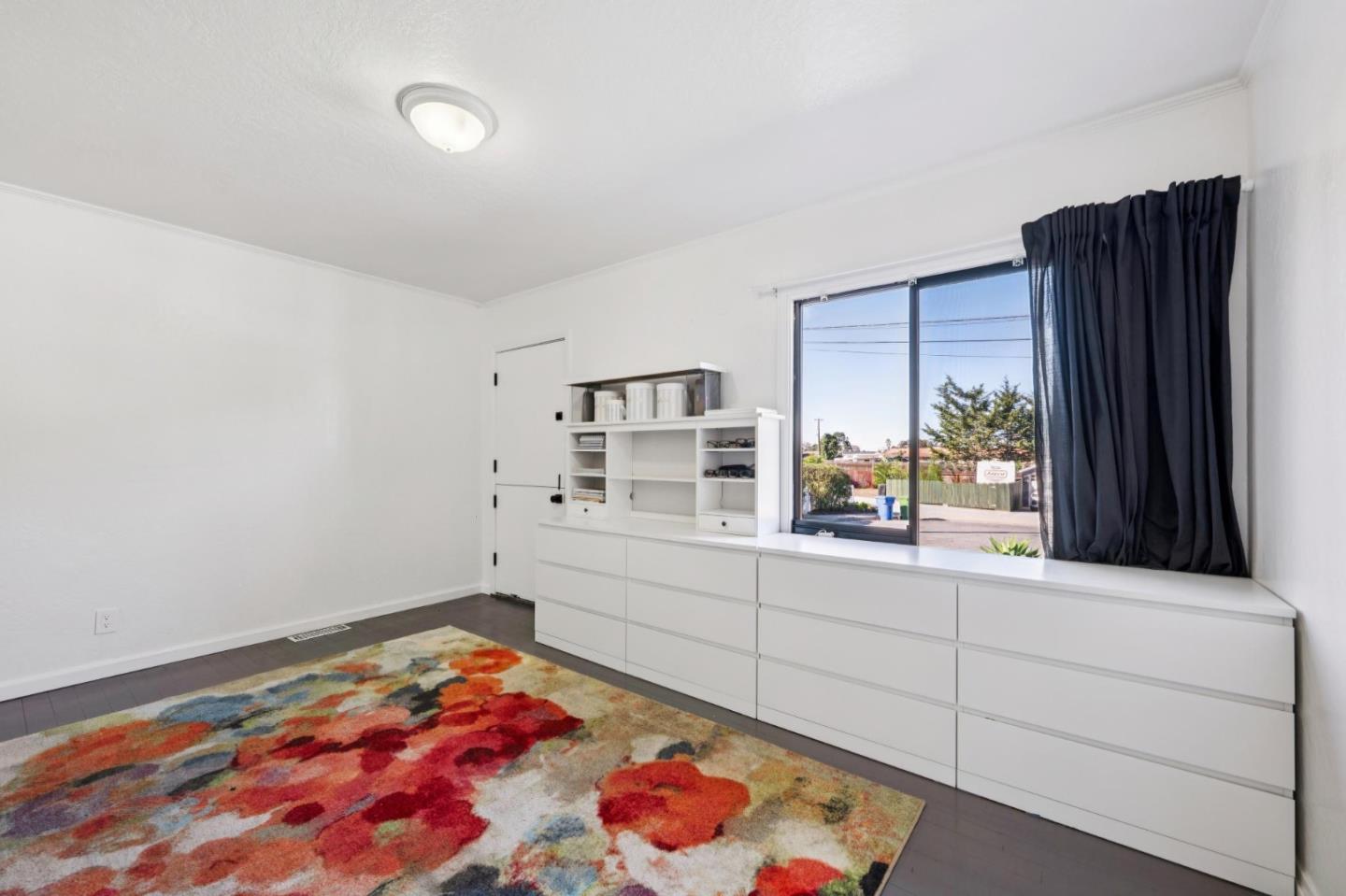 5 Bush Street Monterey, CA 93940 - Photo 30 of 48 a room with a bed and a window