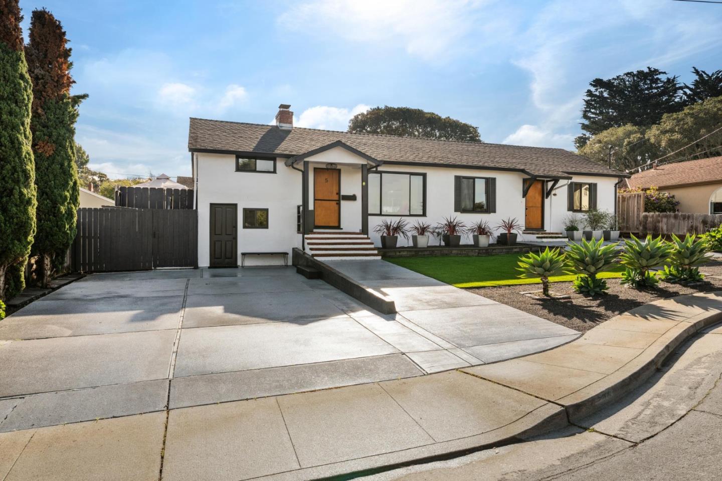 5 Bush Street Monterey, CA 93940 - Photo 3 of 48 a front view of a house with garden