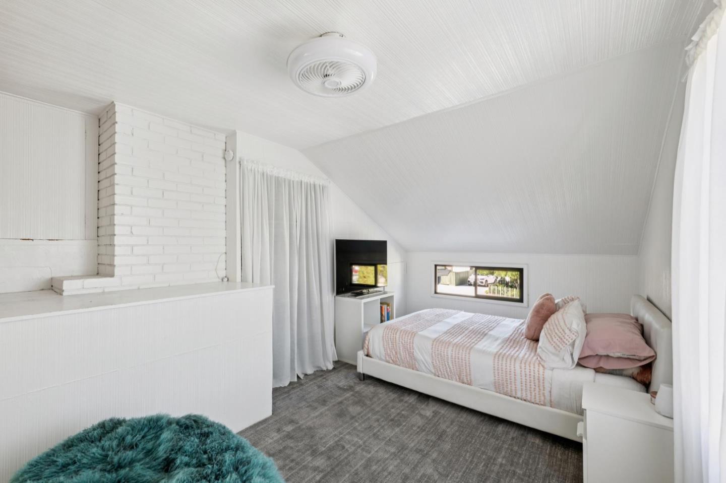 5 Bush Street Monterey, CA 93940 - Photo 33 of 48 a bedroom with a bed and a window