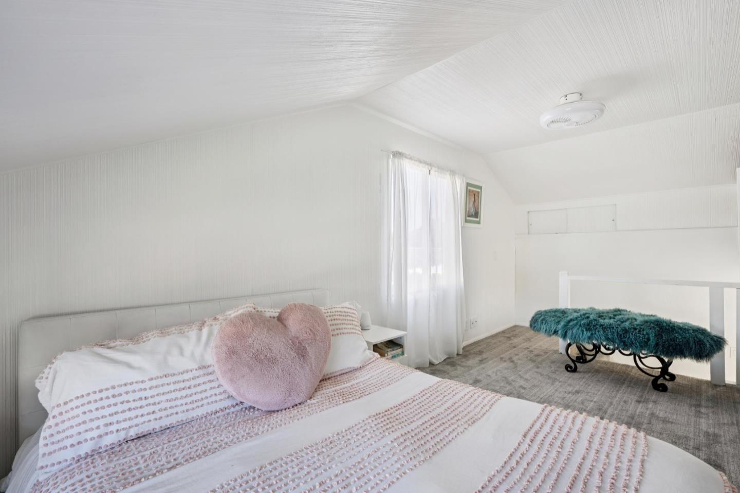 5 Bush Street Monterey, CA 93940 - Photo 34 of 48 a bedroom with a bed and a table