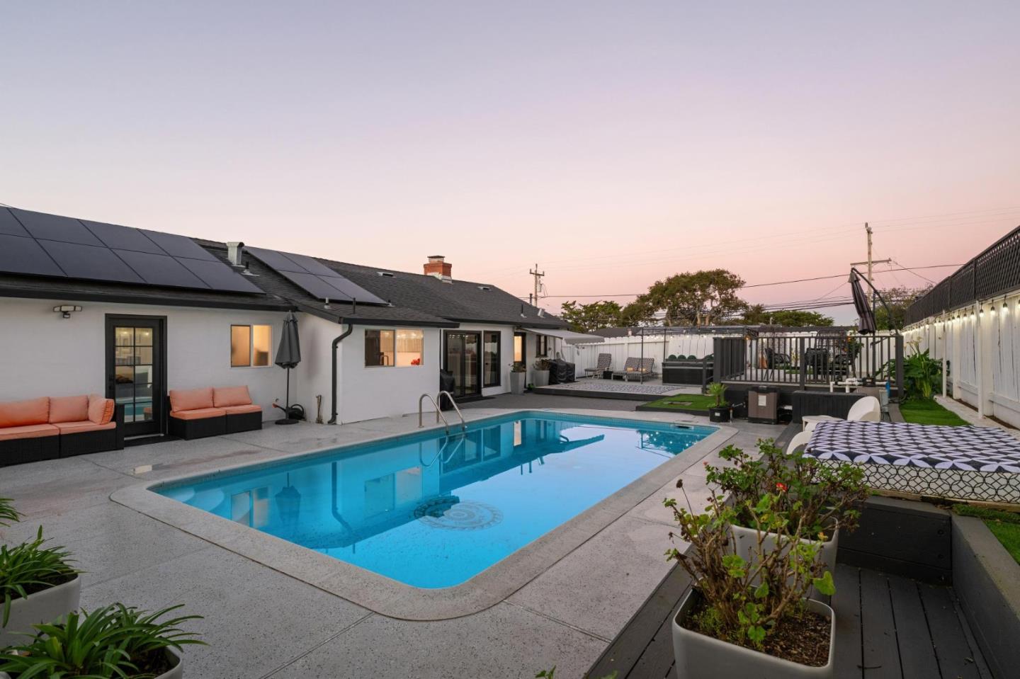5 Bush Street Monterey, CA 93940 - Photo 45 of 48 a view of a house with pool fire pit a chairs and potted plants
