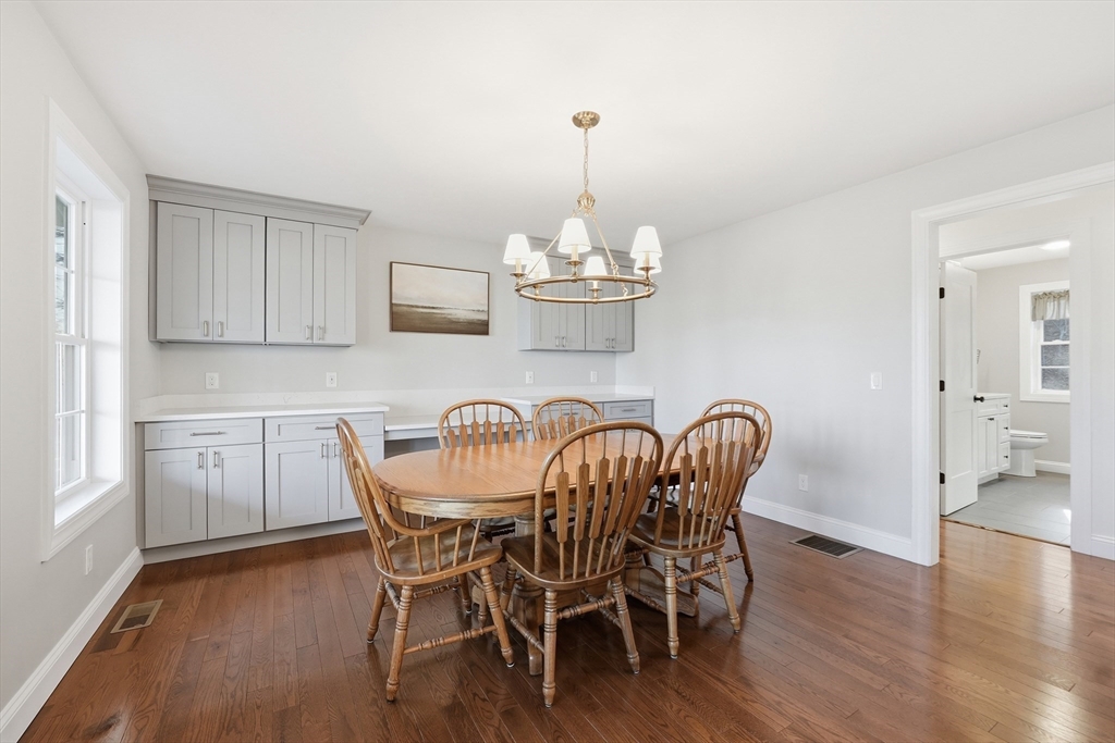 103 Rice Corner Road Brookfield, MA 01506 - Photo 17 of 39 a dining room with furniture a chandelier and wooden floor