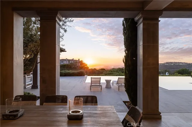 a building outdoor space with patio furniture and potted plants