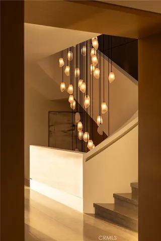 a bathroom with a double vanity sink a toilet and shower