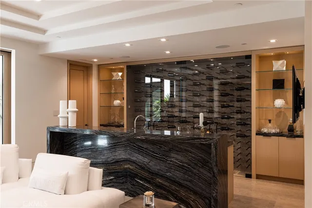 a living room with fireplace furniture and a large window