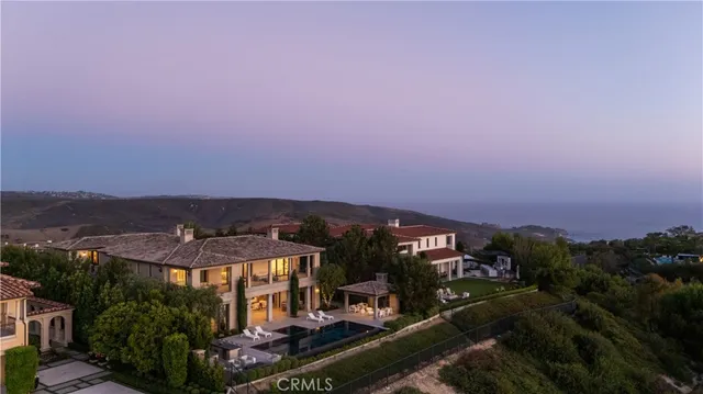 an aerial view of a house with a garden