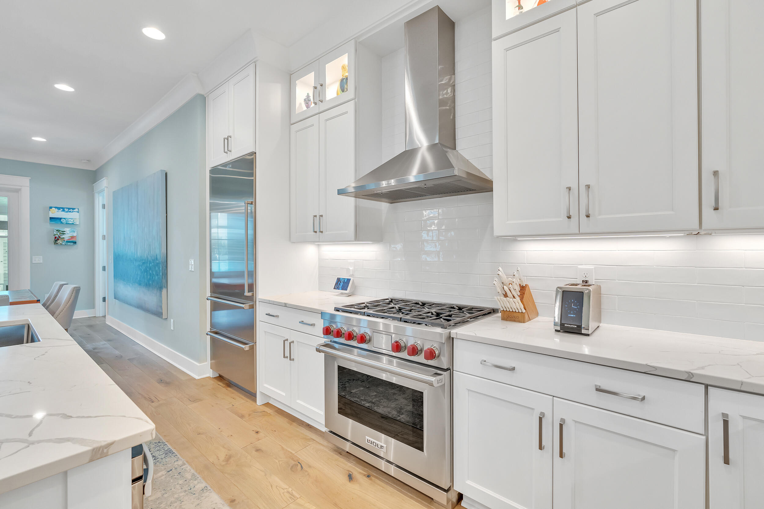 70 Sidecamp Road, Unit LOT 92 Watersound, FL 32461 - Photo 13 of 58 a kitchen with stainless steel appliances a stove a sink and cabinets