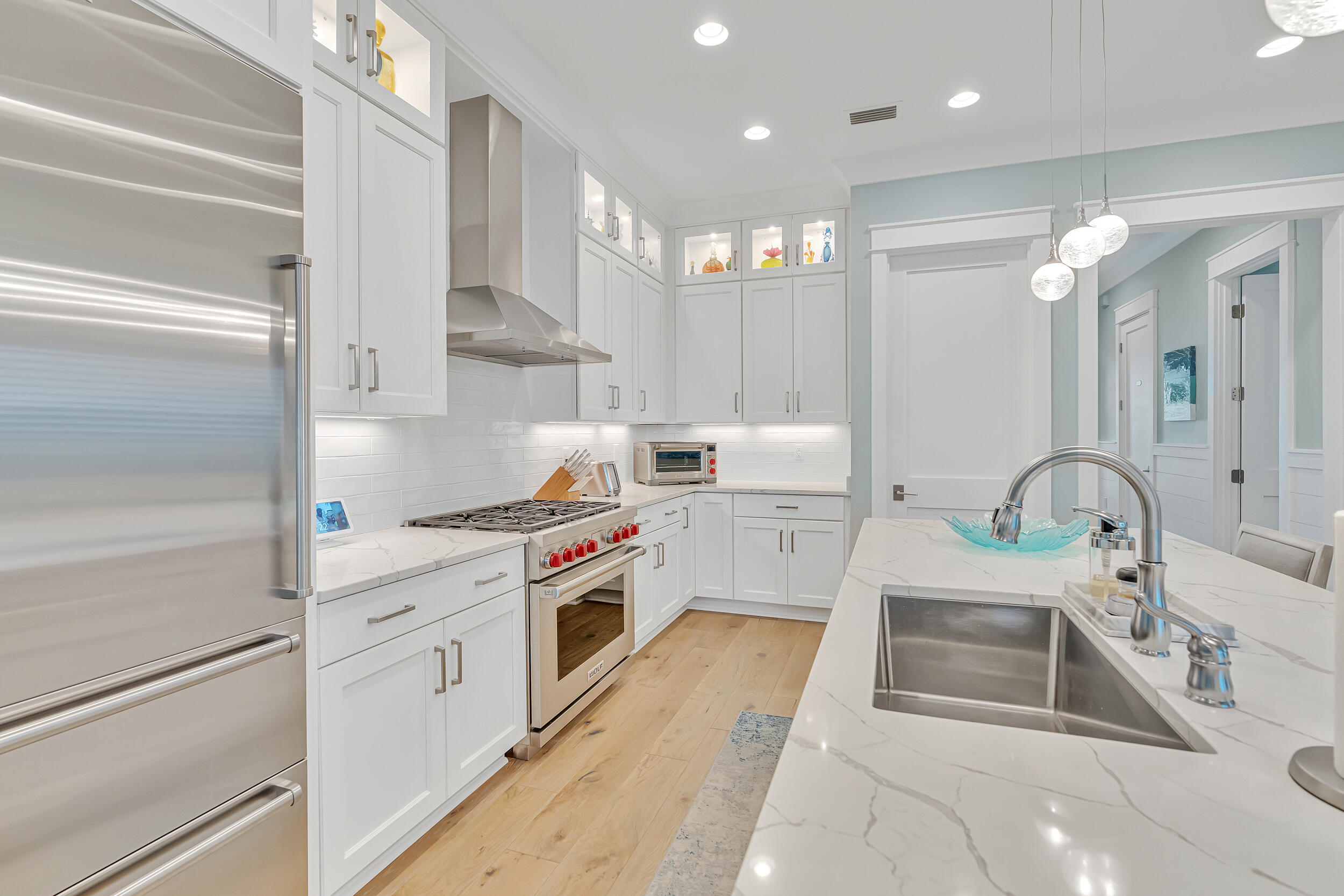 70 Sidecamp Road, Unit LOT 92 Watersound, FL 32461 - Photo 18 of 58 a kitchen that has a lot of white cabinets and stainless steel appliances