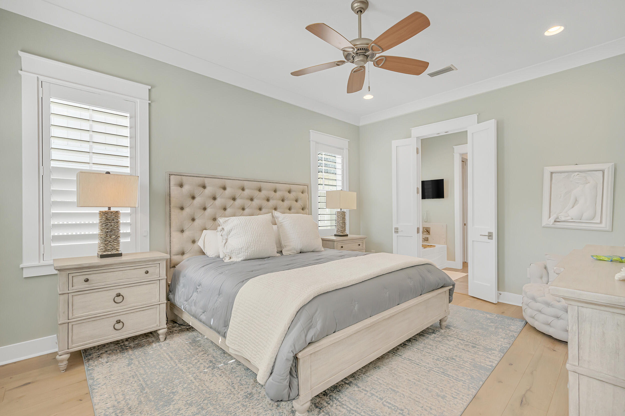 70 Sidecamp Road, Unit LOT 92 Watersound, FL 32461 - Photo 25 of 58 a bedroom with a large bed and a window