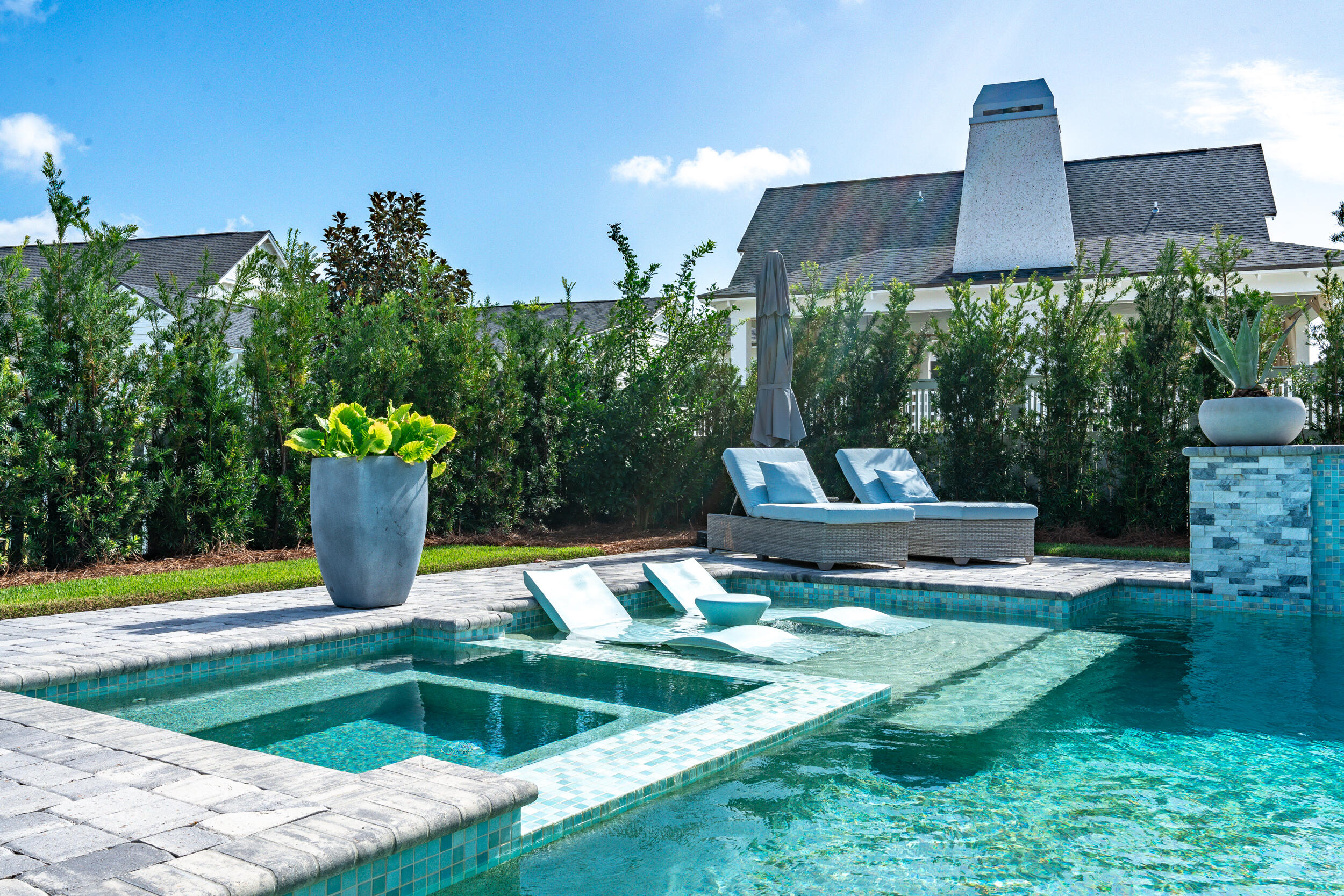 70 Sidecamp Road, Unit LOT 92 Watersound, FL 32461 - Photo 35 of 58 a swimming pool with outdoor seating and yard