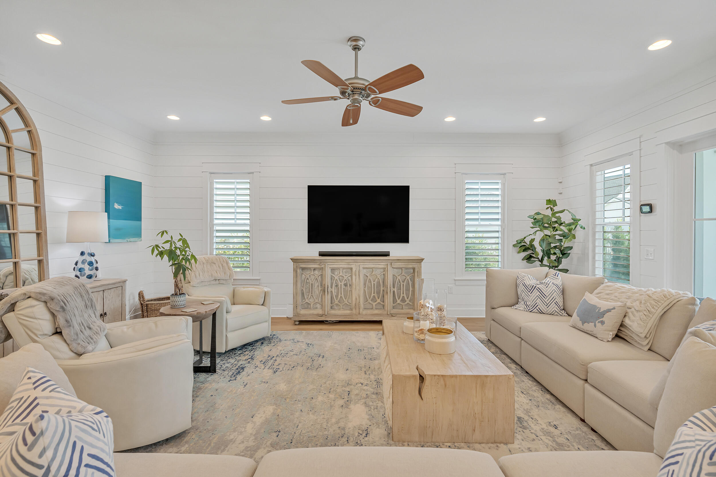 70 Sidecamp Road, Unit LOT 92 Watersound, FL 32461 - Photo 4 of 58 a living room with furniture and a flat screen tv