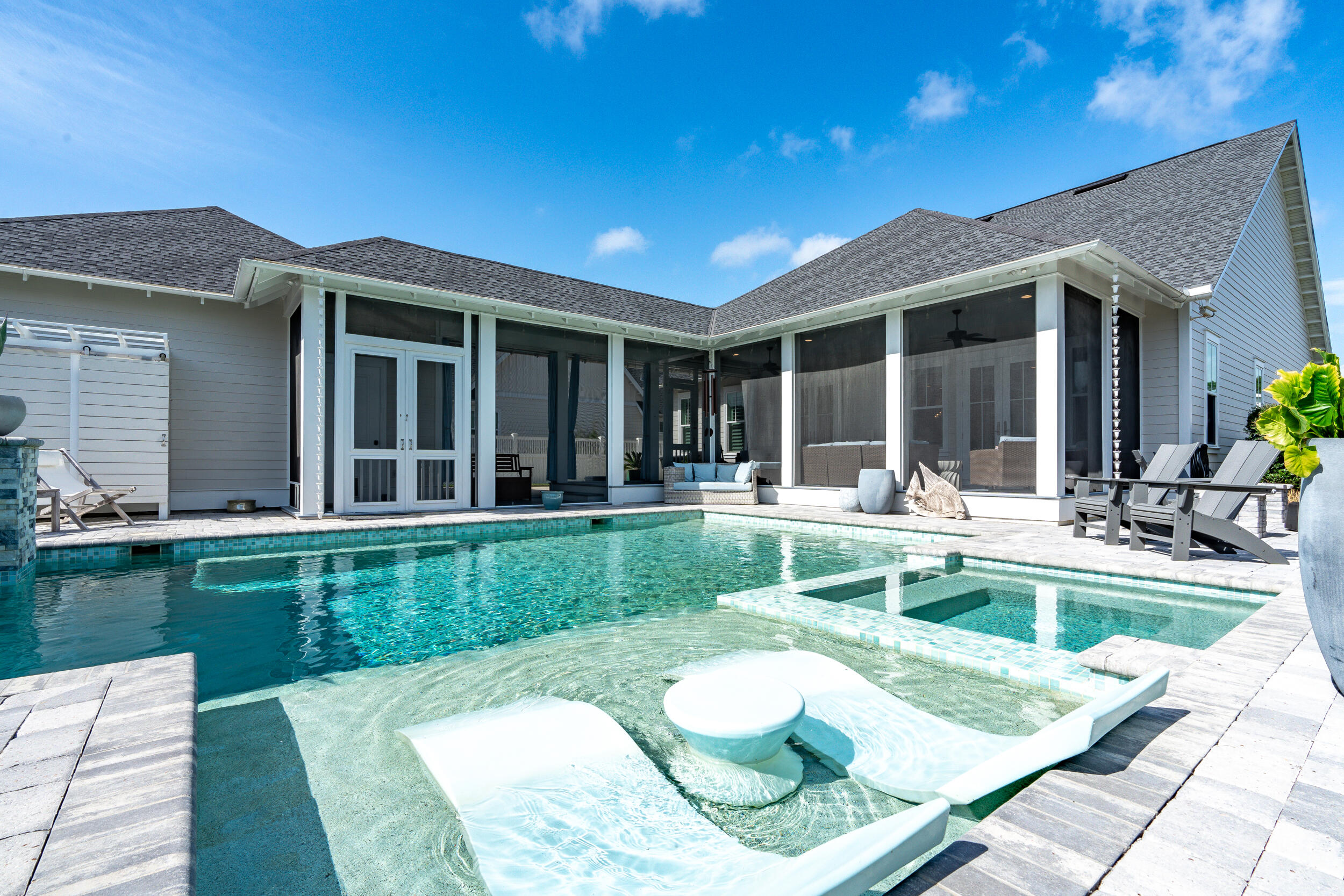 70 Sidecamp Road, Unit LOT 92 Watersound, FL 32461 - Photo 43 of 58 a view of a house with backyard sitting area and swimming pool