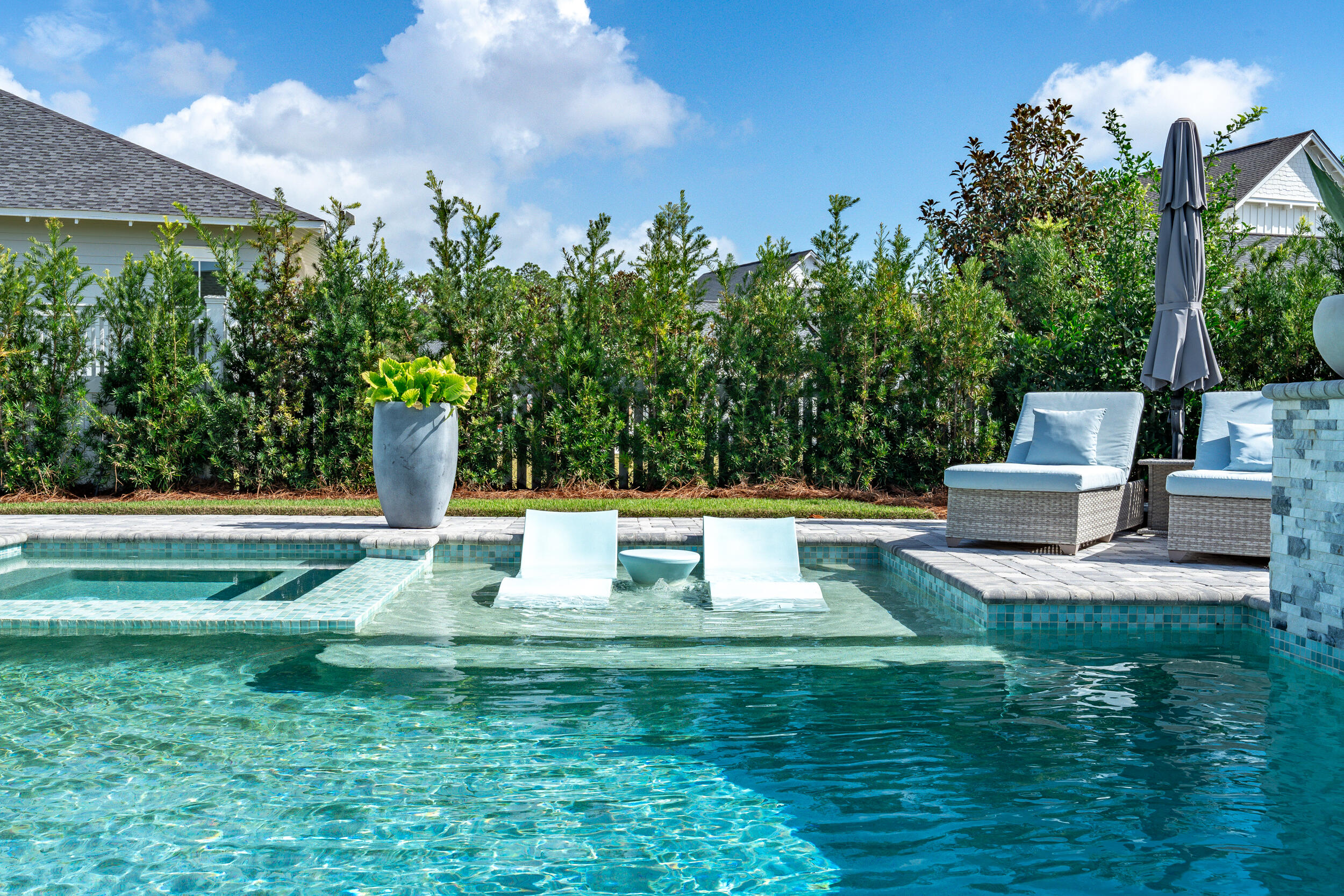 70 Sidecamp Road, Unit LOT 92 Watersound, FL 32461 - Photo 44 of 58 a view of a swimming pool with a patio