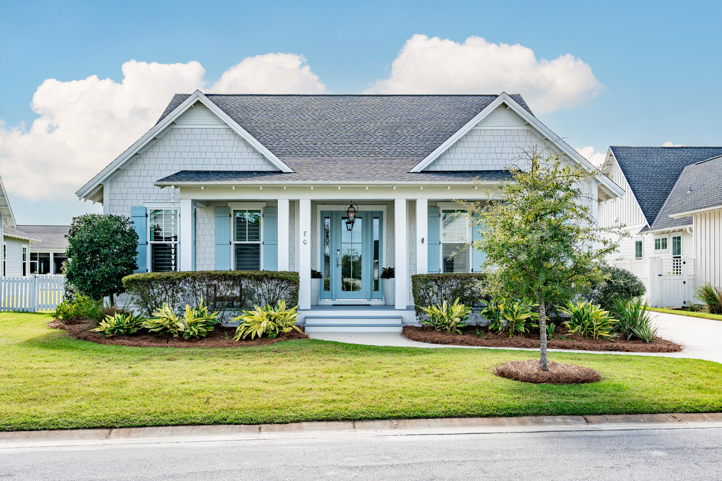 70 Sidecamp Road, Unit LOT 92 Watersound, FL 32461 - Photo 47 of 58 a front view of a house with a yard
