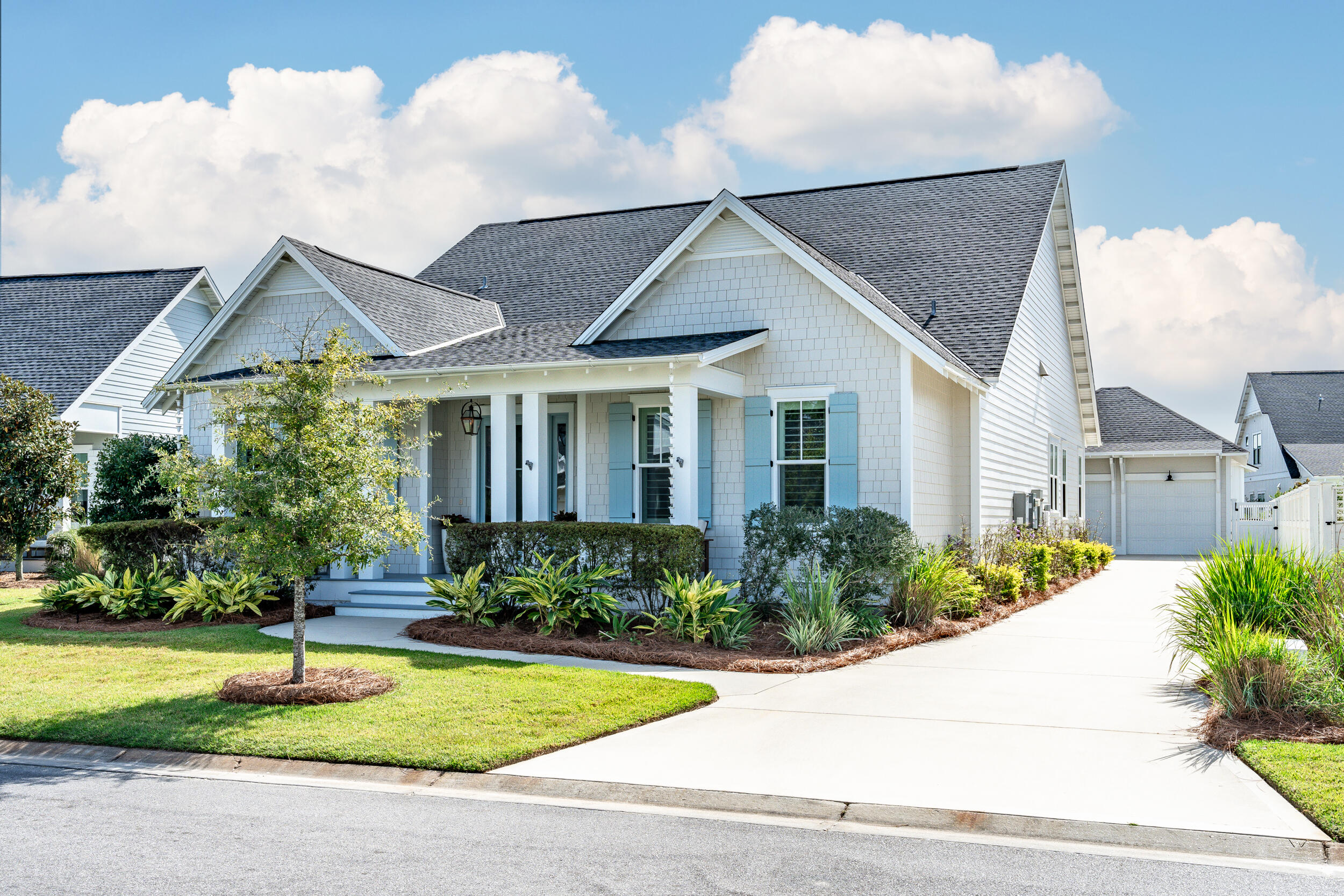 70 Sidecamp Road, Unit LOT 92 Watersound, FL 32461 - Photo 50 of 58 a front view of a house with garden