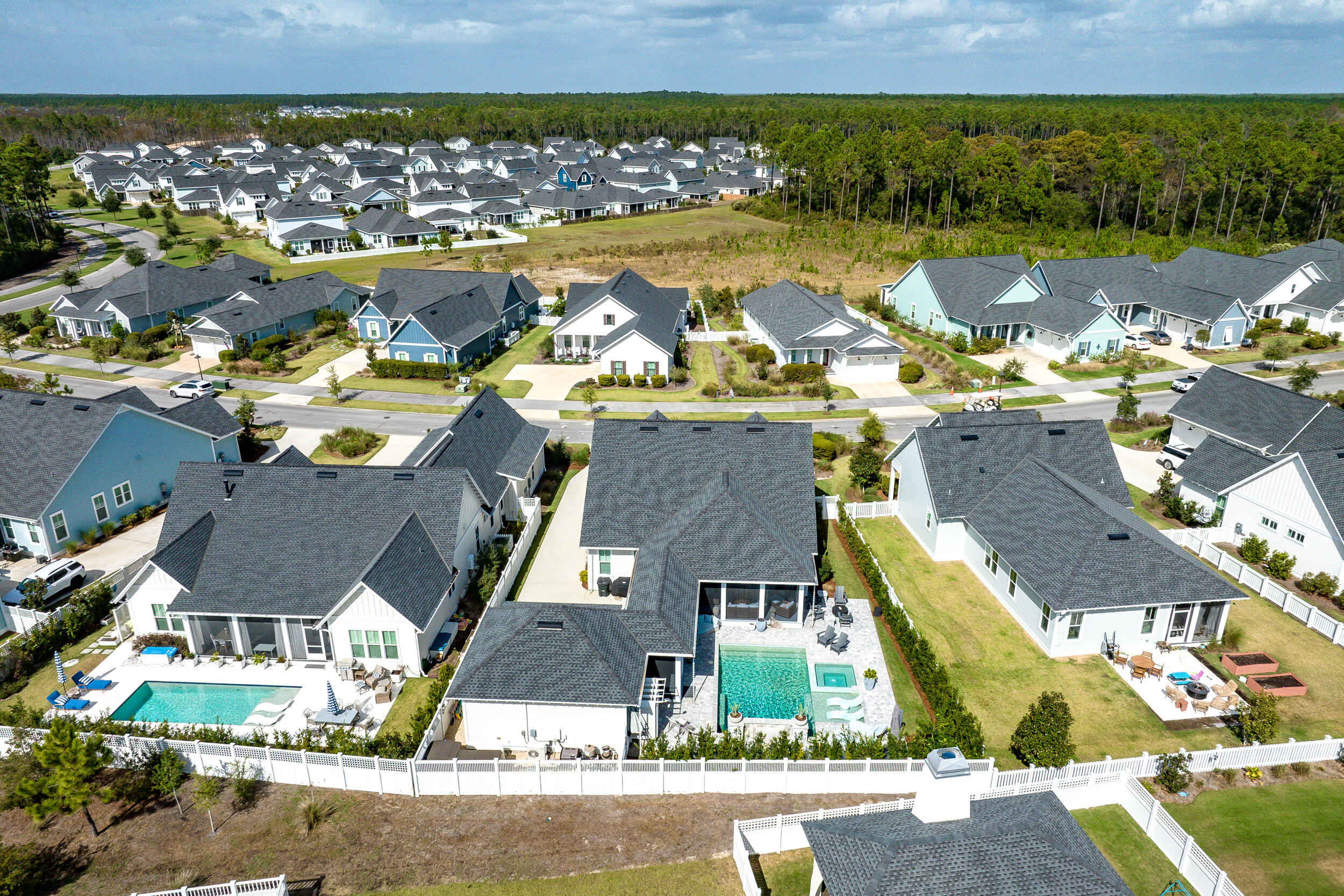 70 Sidecamp Road, Unit LOT 92 Watersound, FL 32461 - Photo 54 of 58 an aerial view of residential houses with outdoor space