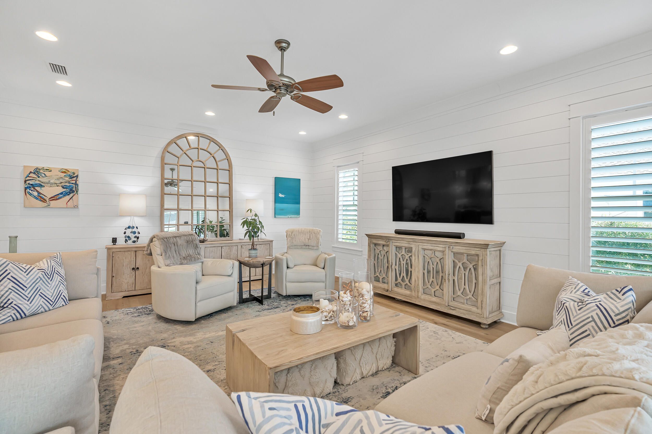 70 Sidecamp Road, Unit LOT 92 Watersound, FL 32461 - Photo 8 of 58 a living room with furniture and a flat screen tv