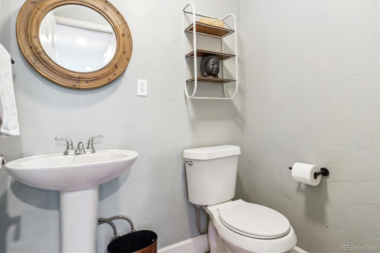 36901 View Ridge Drive Elizabeth, CO 80107 - Photo 13 of 31 a bathroom with a toilet a sink and a mirror