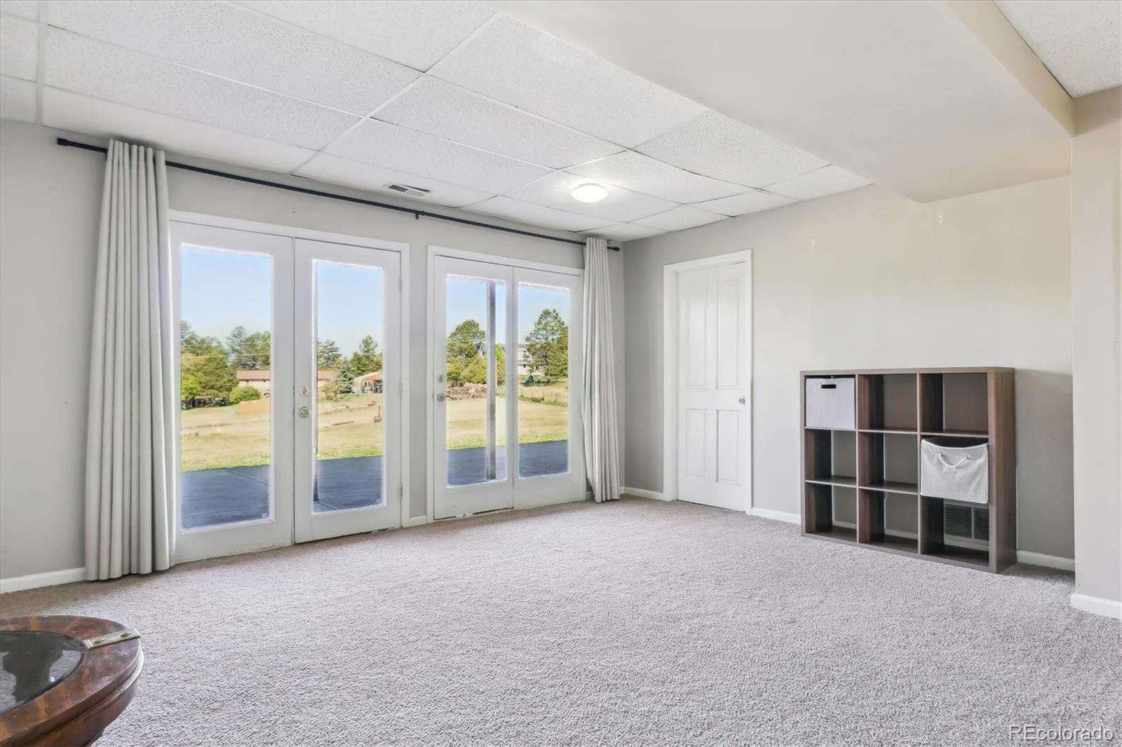 36901 View Ridge Drive Elizabeth, CO 80107 - Photo 14 of 31 an empty room with furniture and large window