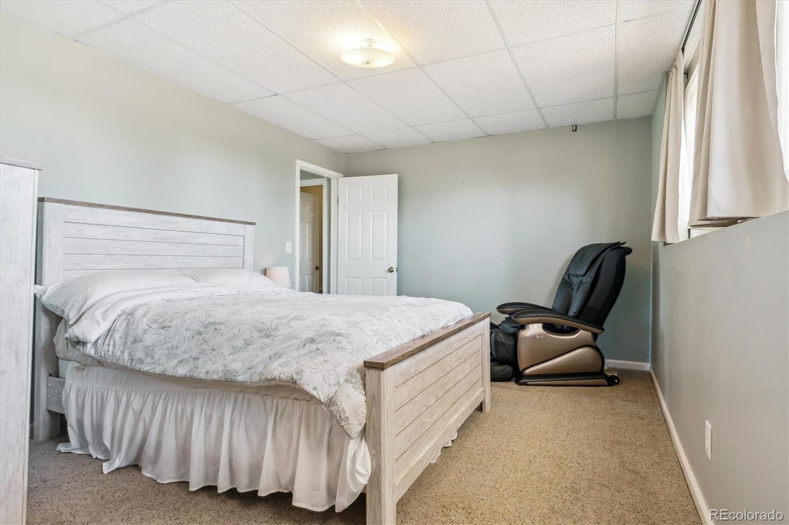 36901 View Ridge Drive Elizabeth, CO 80107 - Photo 19 of 31 a bedroom with a bed chair and window