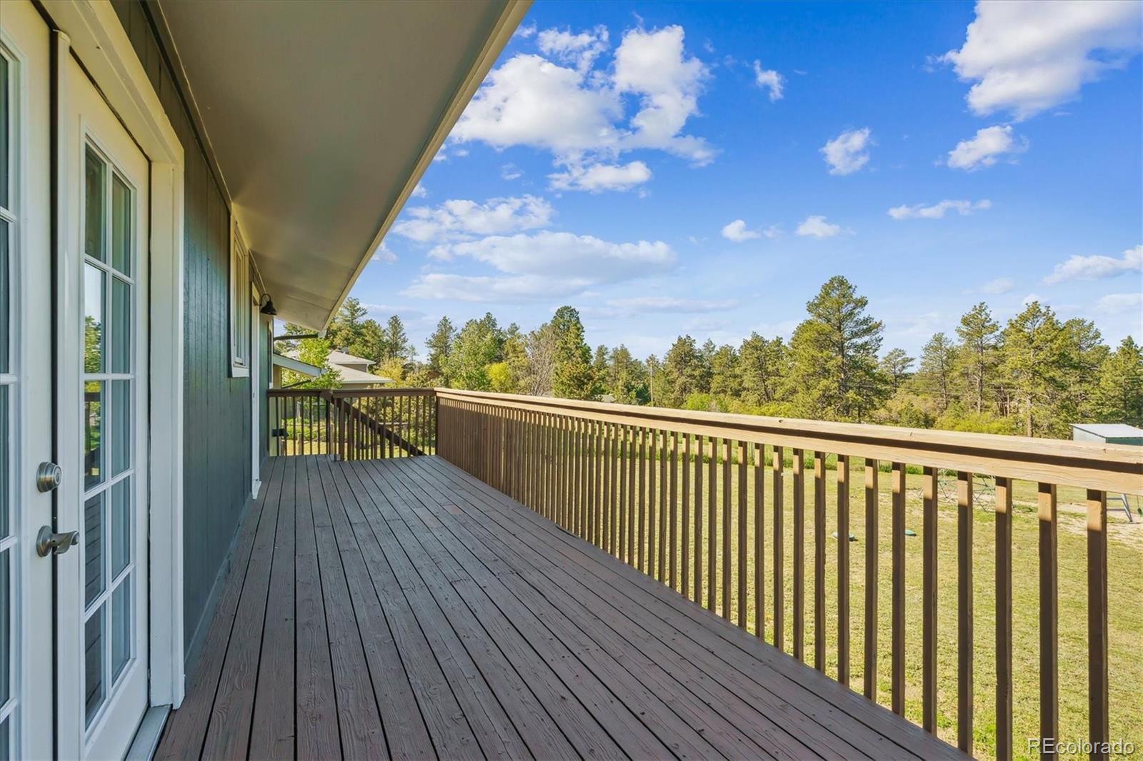 36901 View Ridge Drive Elizabeth, CO 80107 - Photo 24 of 31 a view of a balcony with wooden floor