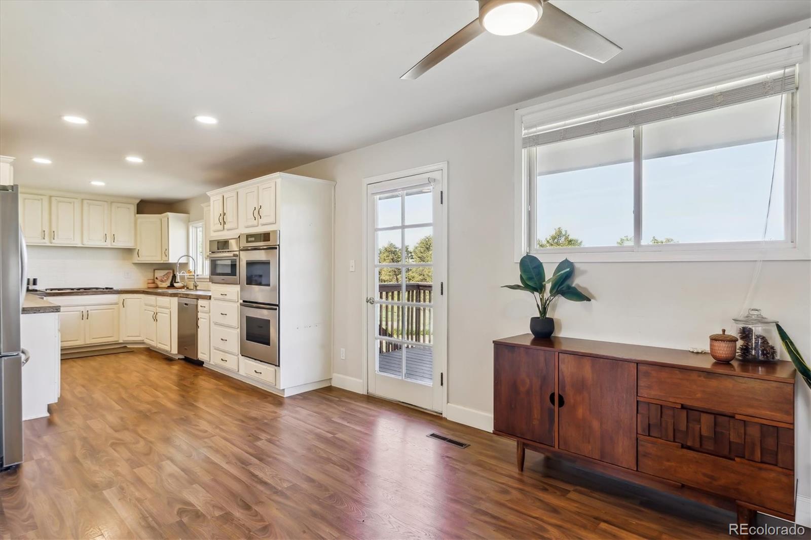 36901 View Ridge Drive Elizabeth, CO 80107 - Photo 4 of 31 a kitchen with white cabinets and appliances