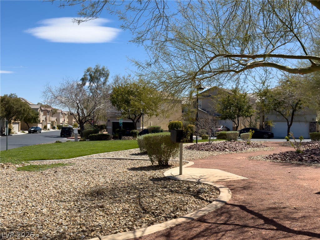 9456 Grandview Spring Avenue Las Vegas, NV 89166 - Photo 46 of 49 A community park with walking paths and green spaces offers residents a tranquil outdoor retreat.