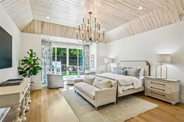 a bathroom with shower and mirror