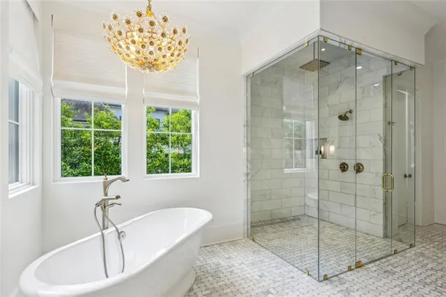 a bathroom with a granite countertop sink and a toilet