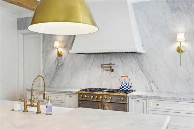 a kitchen with a stove and a table