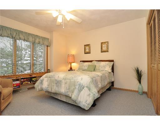 1047 Rimrock Road Greensburg, PA 15601 - Photo 14 of 16 Bedroom. Downstairs bedroom offers terrific views from its large window with built in bookcases beneath.