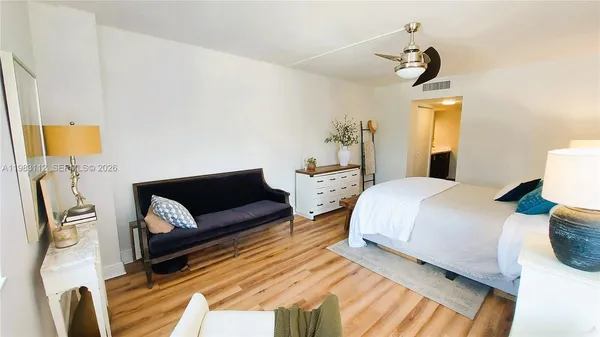a bedroom with bed and window