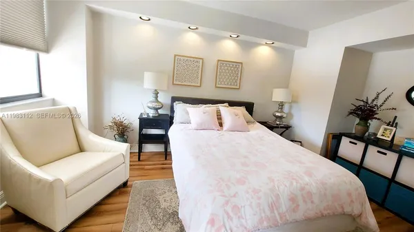a bed room with a bed and a couch