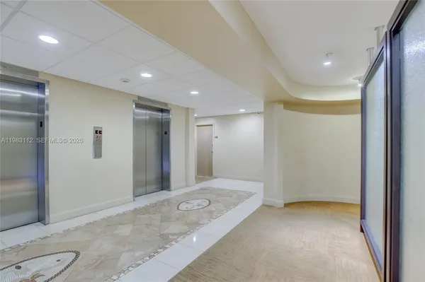 a view of hallway with a large mirror