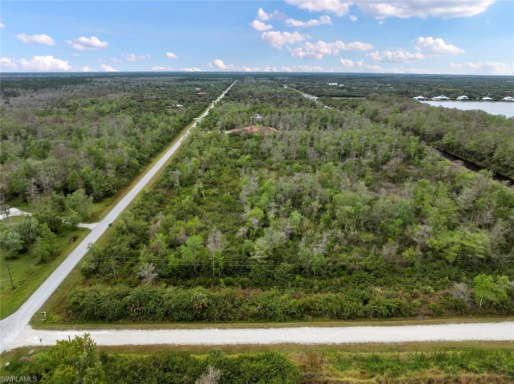 47th Avenue Northwest Naples, FL 34120 - Photo 6 of 11 a view of a lush green field