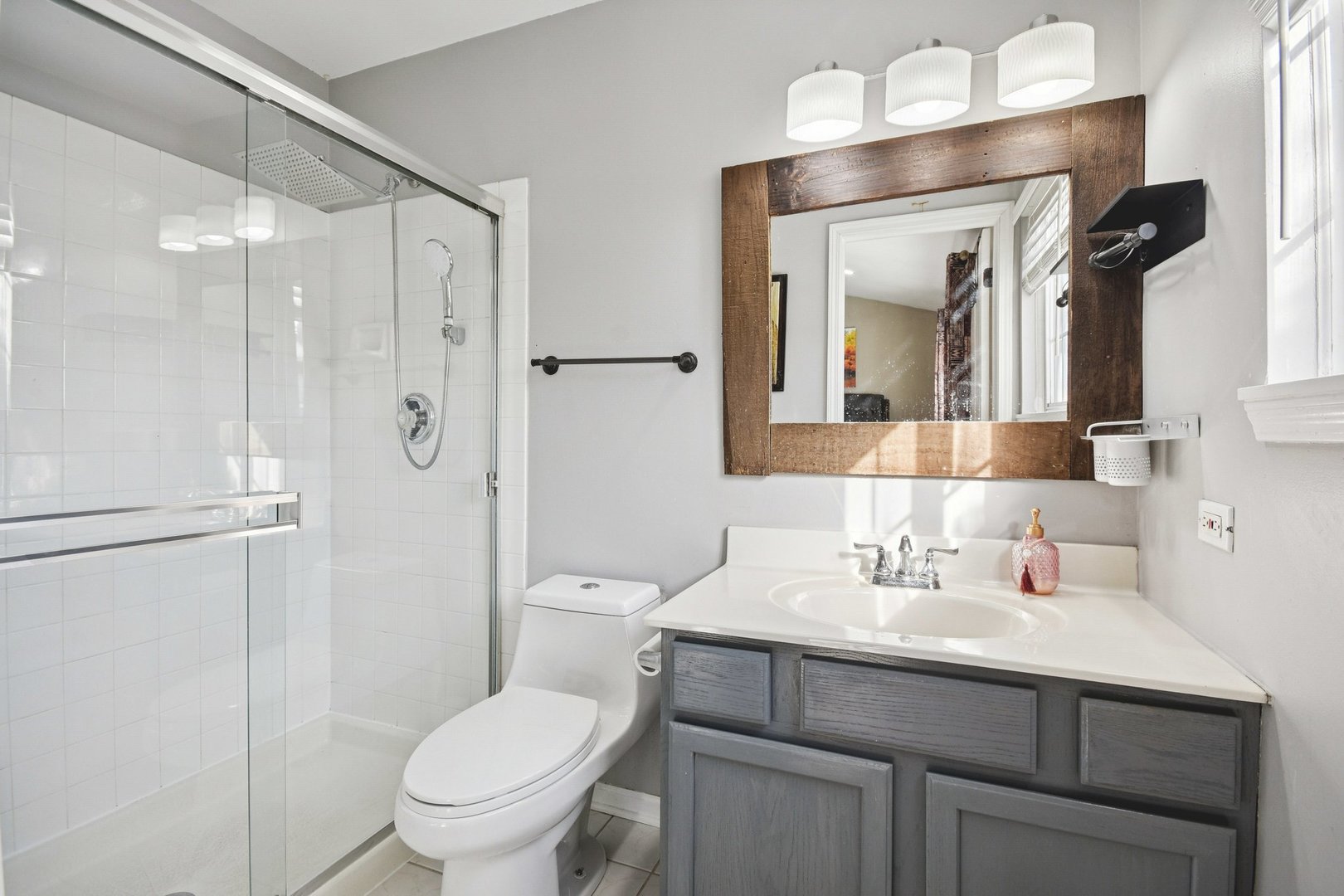 521 Ivory Lane Bartlett, IL 60103 - Photo 15 of 28 a bathroom with a sink toilet vanity and shower