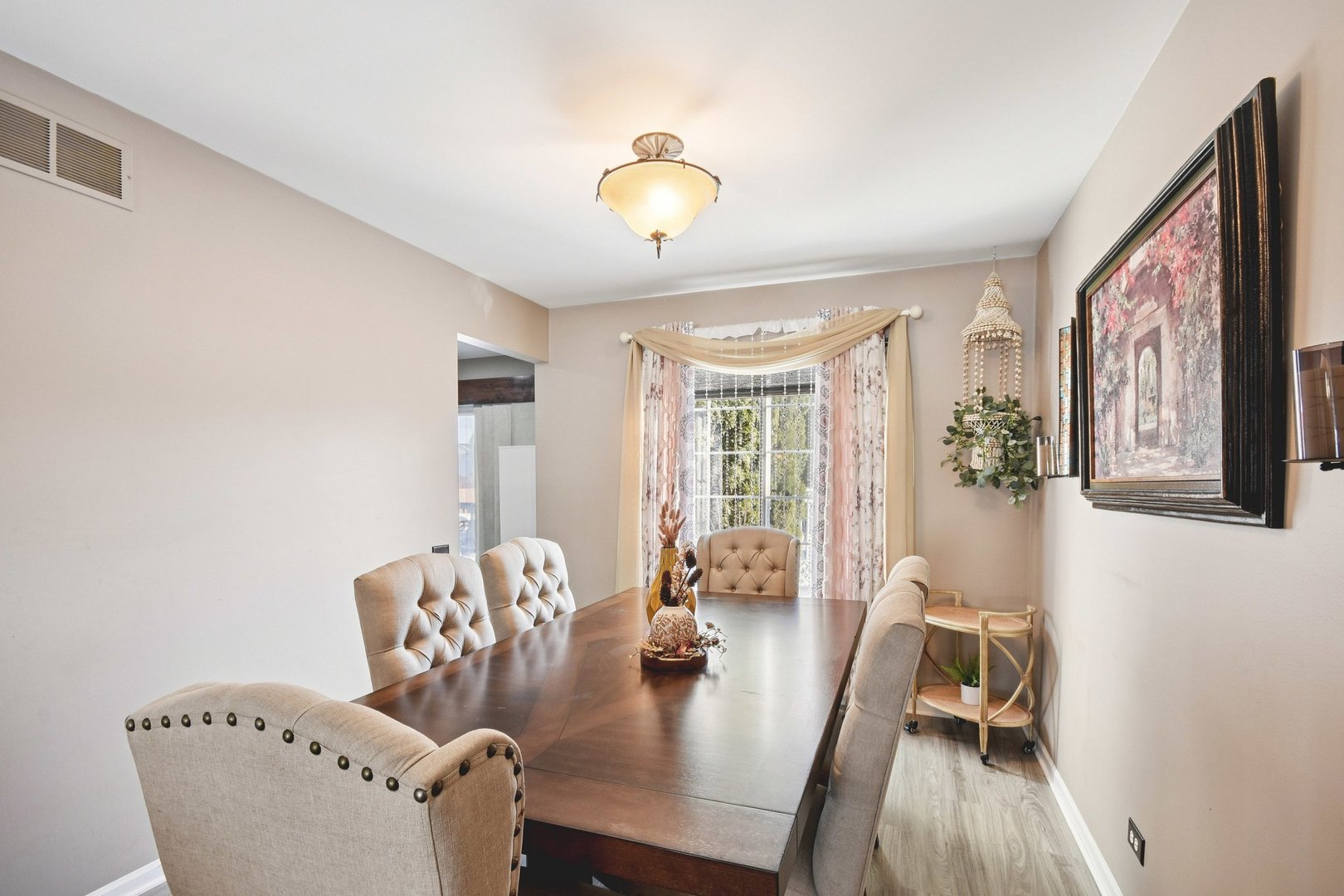 521 Ivory Lane Bartlett, IL 60103 - Photo 4 of 28 a view of a dining room with furniture window and wooden floor