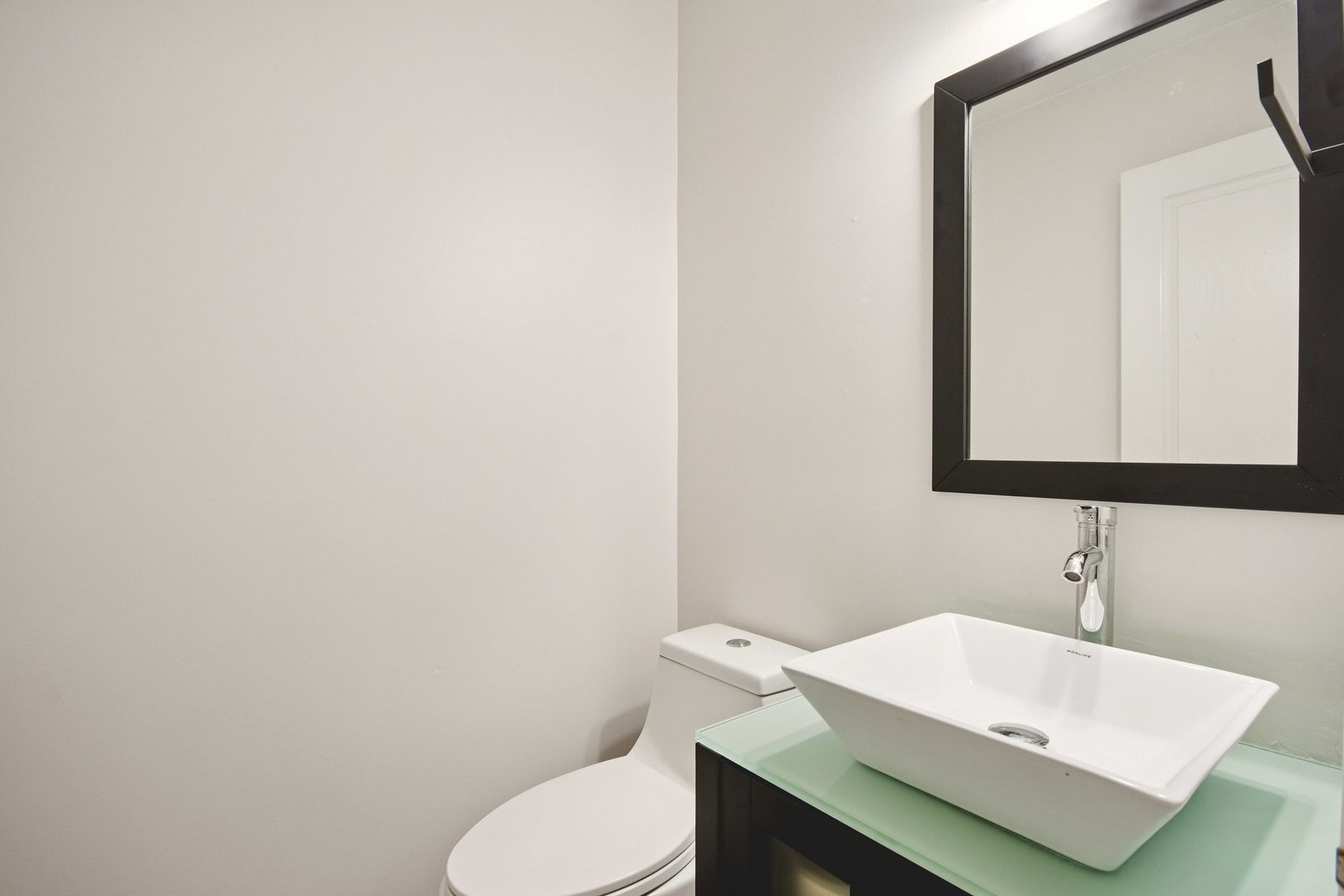 521 Ivory Lane Bartlett, IL 60103 - Photo 10 of 28 a bathroom with a sink a toilet and mirror