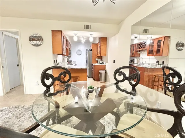 a view of a livingroom with furniture and kitchen