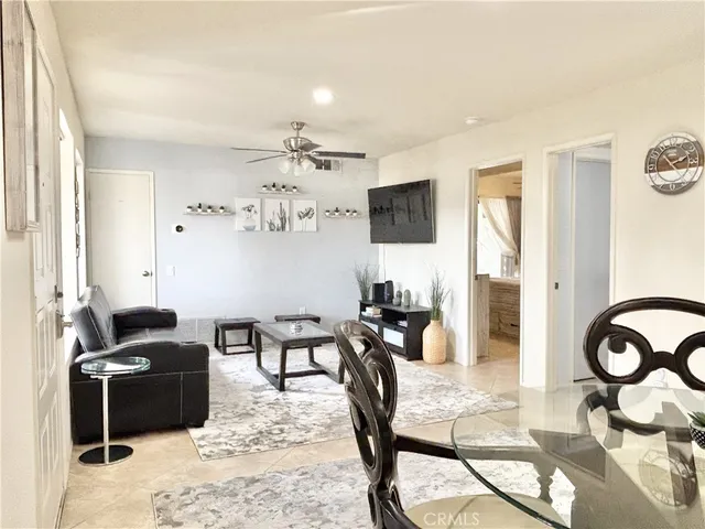 a view of a livingroom with furniture and a flat screen tv
