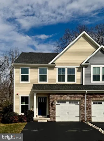 a front view of a house with garage