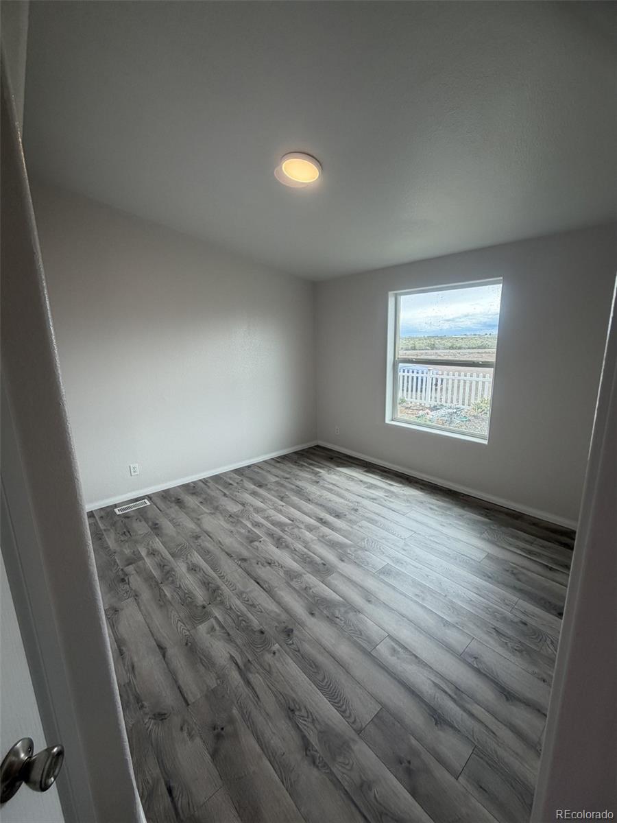 5511 Ridgetop Court Alamosa, CO 81101 - Photo 8 of 10 an empty room with windows