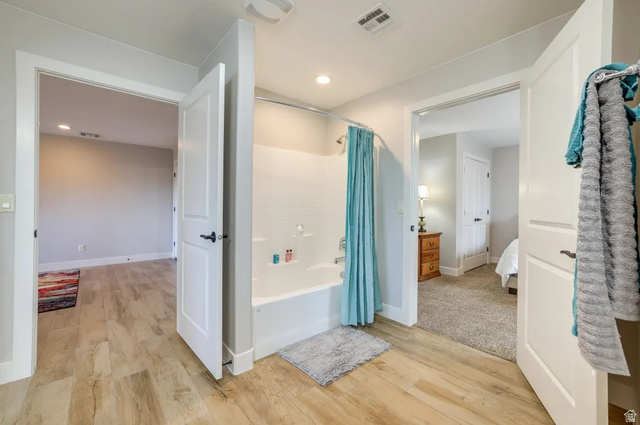 217 West Terrace Circle Toquerville, UT 84774 - Photo 11 of 25 Full bath with shower / tub combo with curtain, ensuite bathroom, light wood-style floors, and recessed lighting