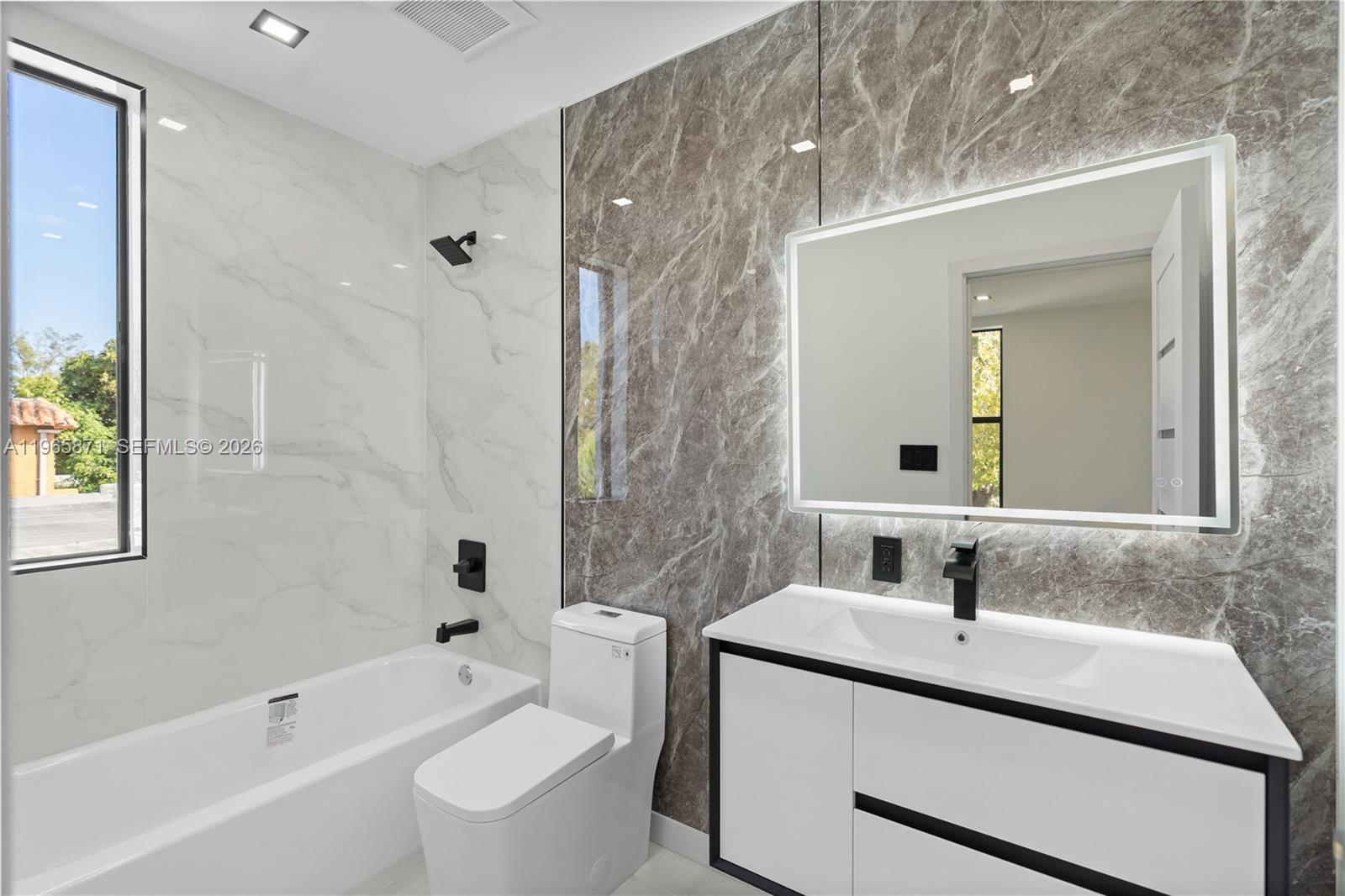 1644 Northwest 8th Terrace Miami, FL 33125 - Photo 35 of 60 a bathroom with a sink toilet tub and shower